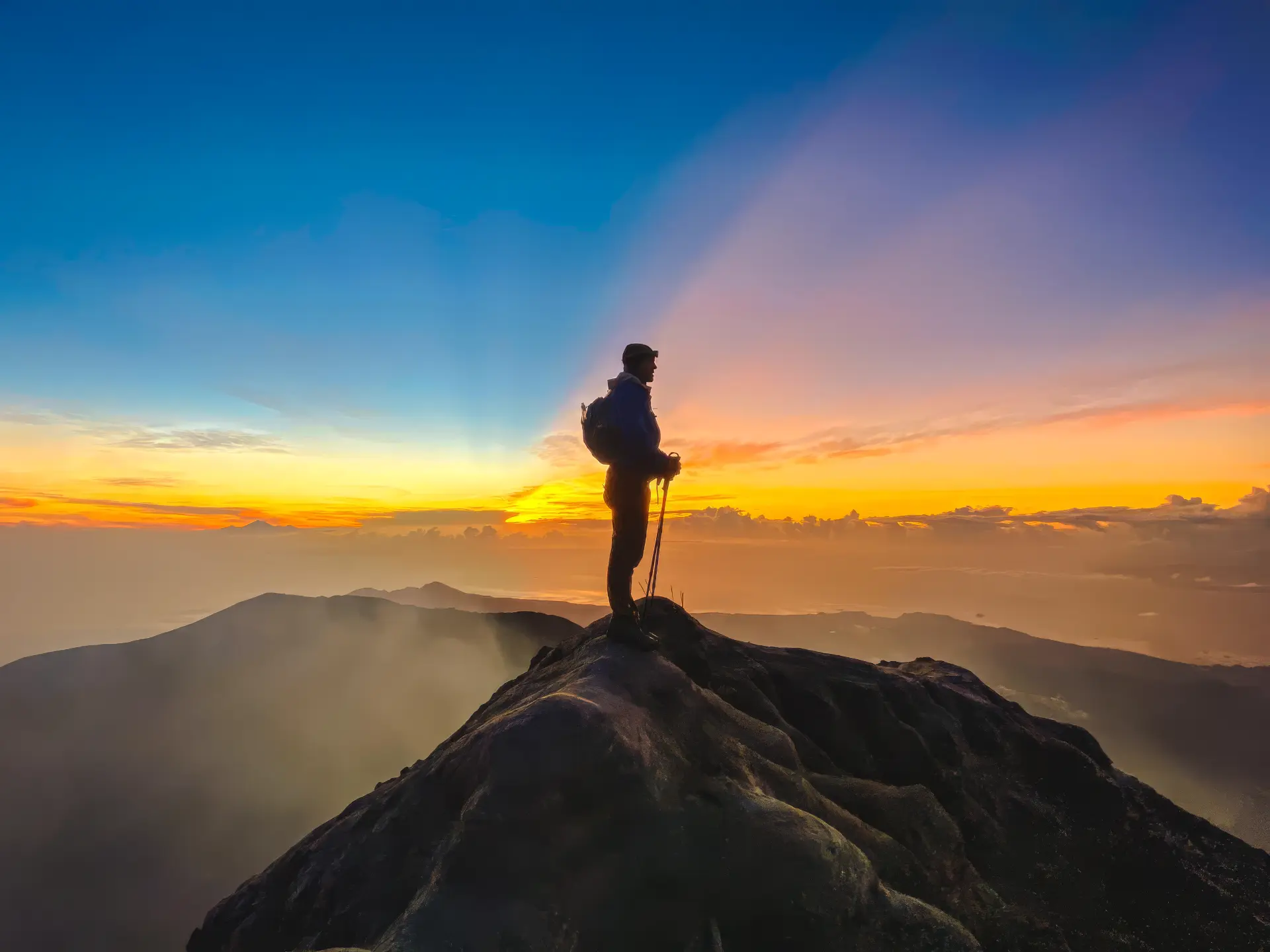 Jesse Kirley on the summit of Mount Agung at sunrise, Bali